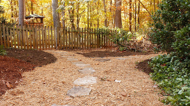 landscaped backyard with mulch pathway