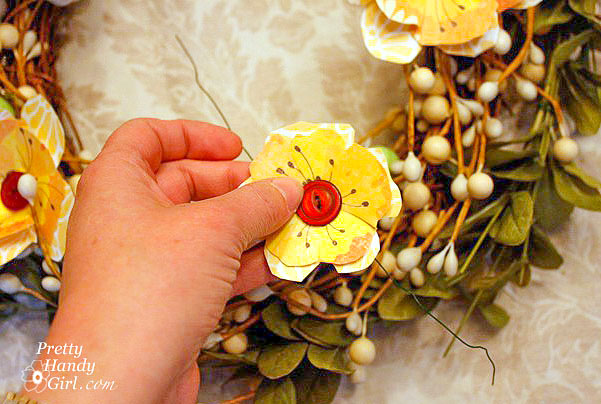 add button flower to wreath