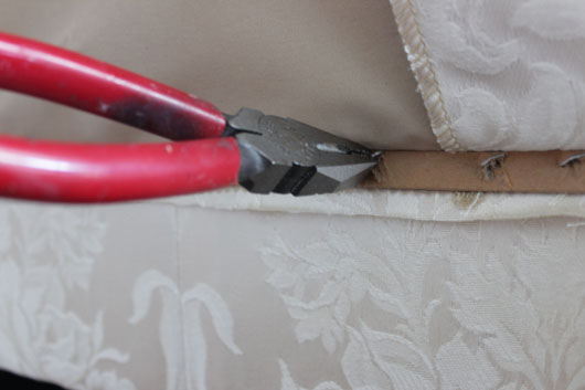 pulling out staples from sofa skirt