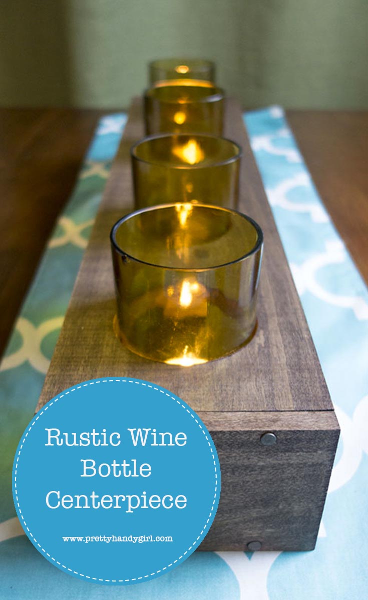 Easily upcycle old glasses with this DIY rustic wine bottle centerpiece from Pretty Handy Girl! | Upcycle project | rustic table centerpiece #prettyhandygirl #DIY #tabledecor