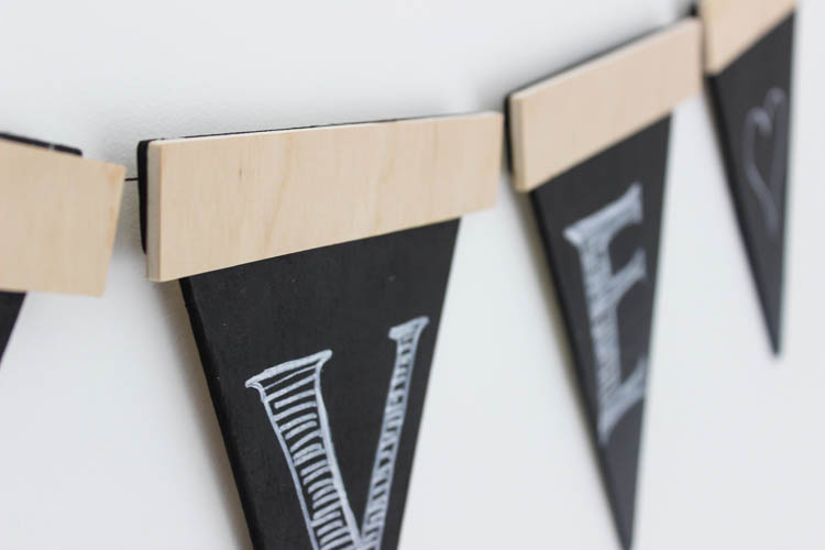 Love this twist on the traditional party banners! This rustic wooden version can be used again and again.