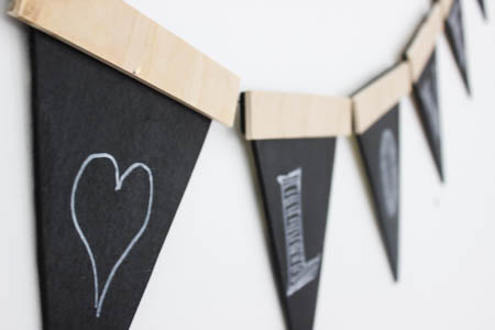 Love this twist on the traditional party banners! This rustic wooden version can be used again and again.