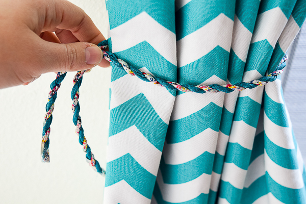 Measure the curtain tie back cord to make sure it is tight enough to hold the curtains in place.