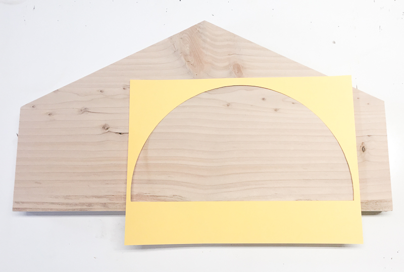 Trade a half circle onto your scrap wood and cut out with a jigsaw.