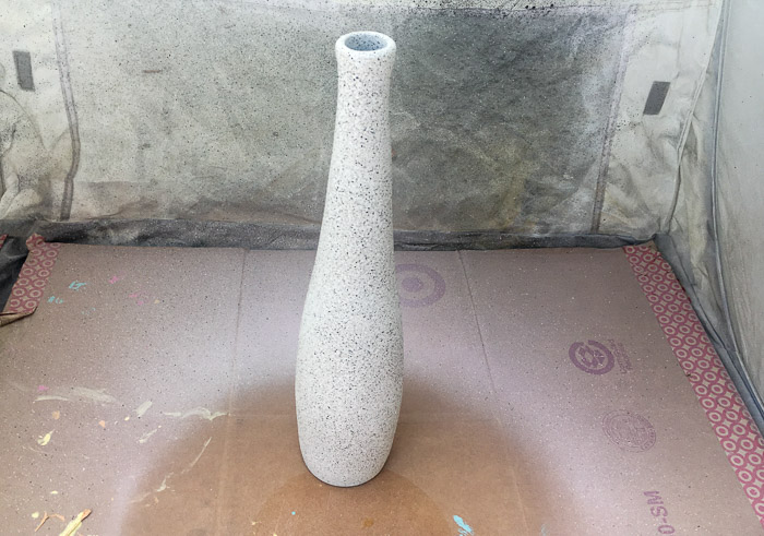 Recycled glass vase with stone spray paint and clay flowers