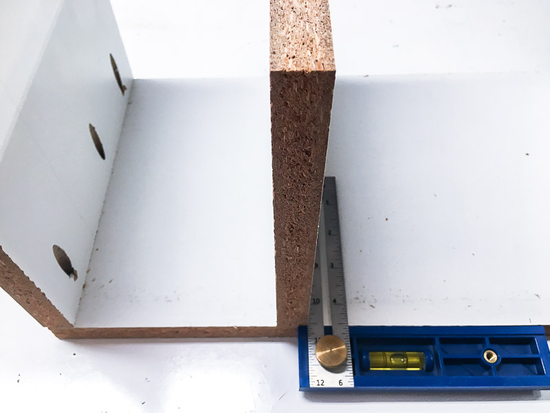 Attach the vertical pieces of the cordless drill storage box with pocket hole screws.
