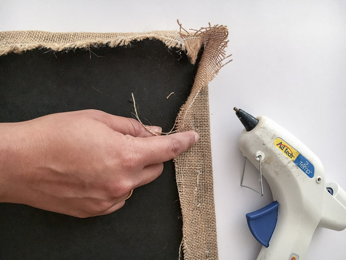 Attach burlap on rok to make a burlap covered bulletin board