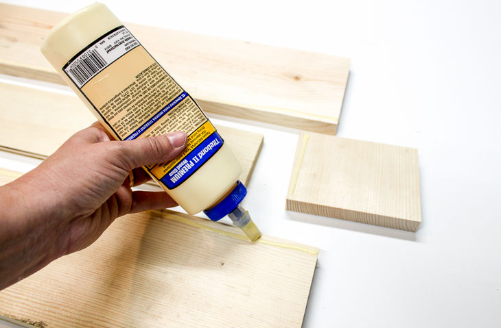 Add wood glue along bottom edges of sides.
