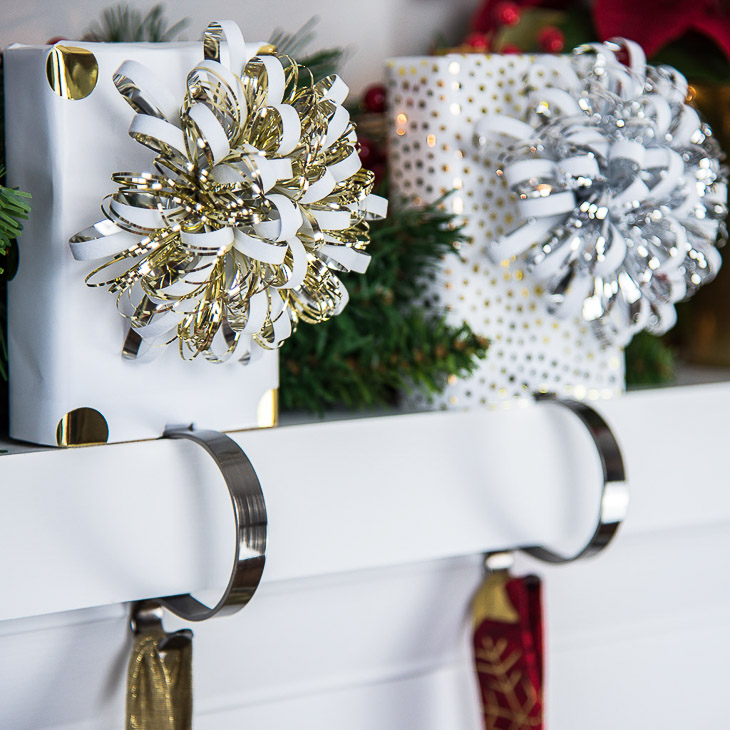 Decorate your mantel for Christmas with these DIY stocking holders made of scrap wood!