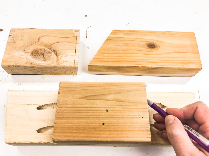 Cut all your scrap wood pieces the same size to make these stocking holders.