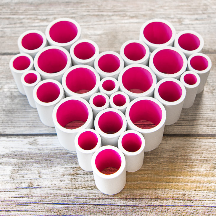 Who knew PVC pipe could look this good? With some paint and hot glue, you can easily make this heart decoration for Valentine's Day!