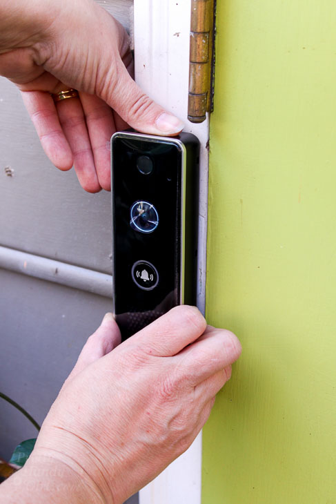 Set video doorbell into mounting bracket
