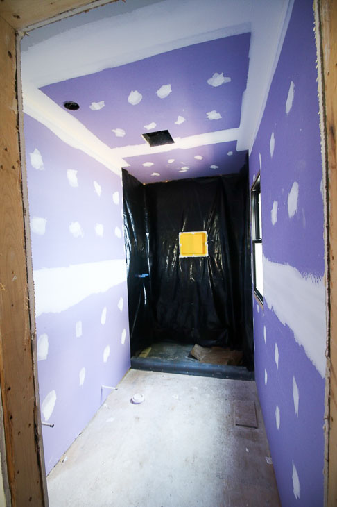 purple drywall in master shower