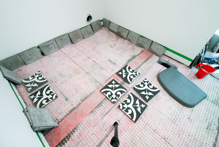 Layout cement tiles starting in the center.