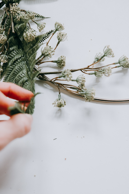 Use greenery to help hide the floral wire on your hoop wreath