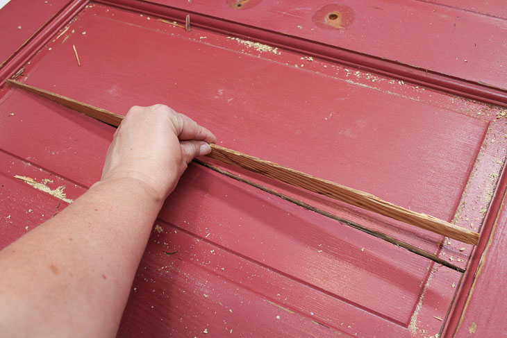Insert wood spline into door crack