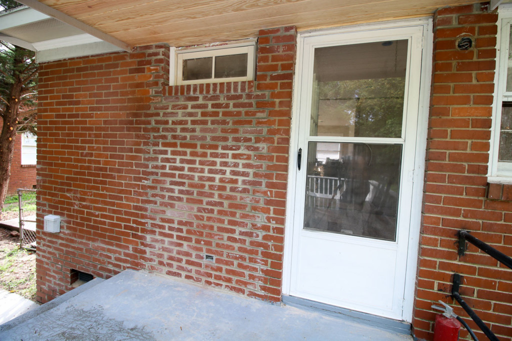 back door bricked up with transom window installed